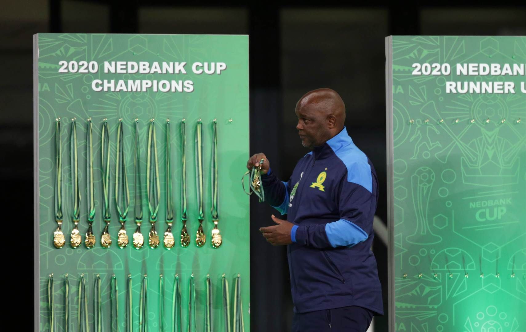 Pitso Mosimane collecting his winners medal 