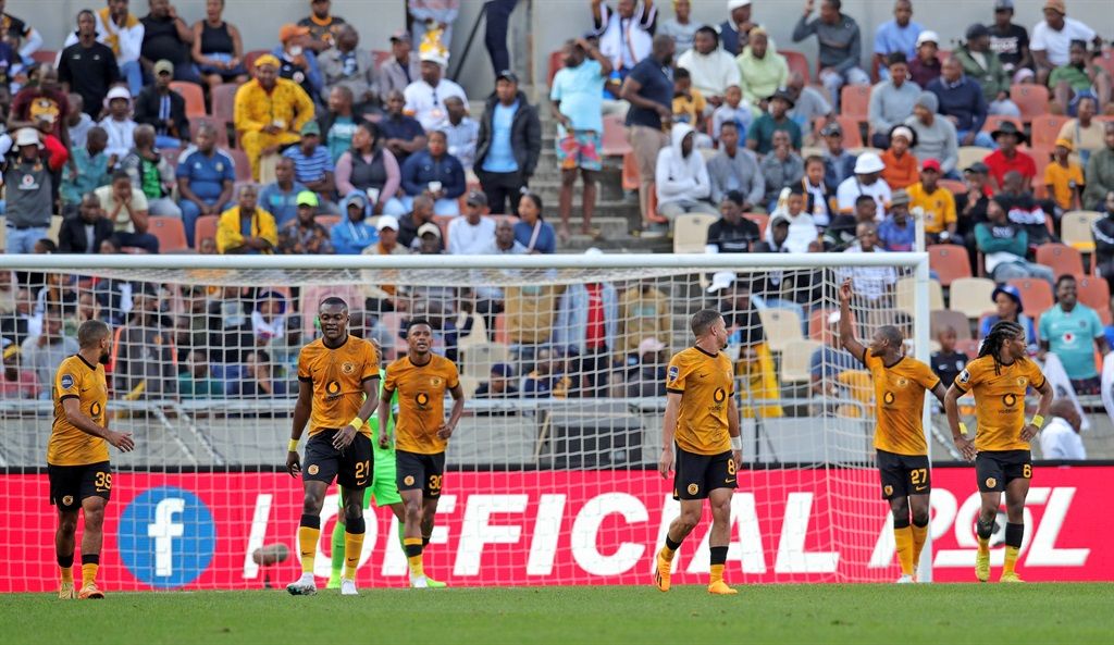 Kaizer Chiefs players react to a goal during the D
